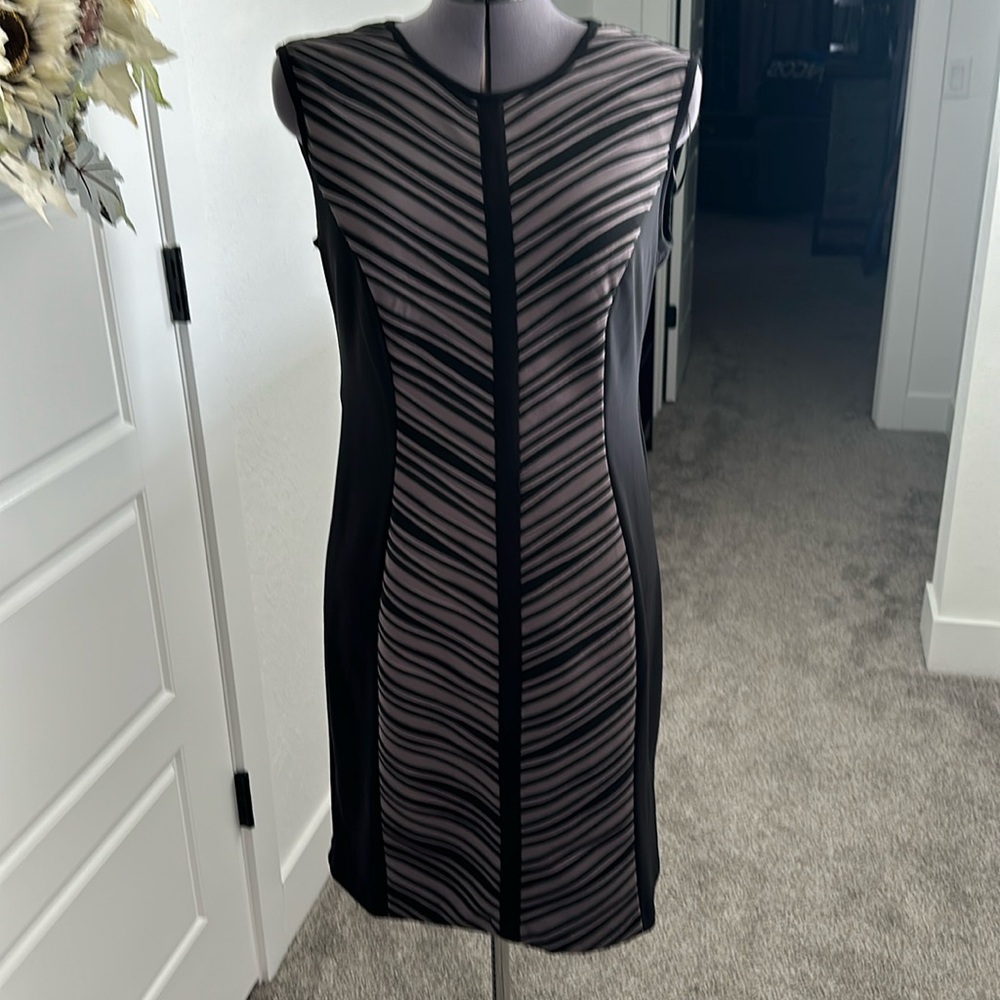 Women’s black dress with pale purple detail on front